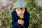 Beautiful portrait of a young preschool child holding flower