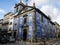 Beautiful Portuguese blue ceramic tile church with bell tower on corner in Porto, Portugal.