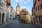 Beautiful postcard view of the famous historic town of Rothenburg ob der Tauber on a sunny day with blue sky and clouds