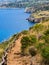 Beautiful postcard view of the Sicilian rocky coast in Italy, walking on a dirt path in the Gypsy Reserve