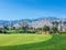 A beautiful practice area in Palm Springs, California, United States. The chipping green has a bunch of golf balls by the hole