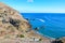 Beautiful Prainha Beach by the Atlantic Ocean in Madeira, Portugal. Surrounded by volcanic landscape and cliffs, people on the