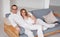 Beautiful Pregnant Couple . Handsome husband and wife expecting baby. In a white home interior. Maternity, Pregnancy