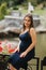 Beautiful pregnant lady in blue dress smile. Tenderness woman walk outside. Six months of pregnancy