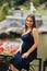 Beautiful pregnant lady in blue dress smile. Tenderness woman walk outside. Six months of pregnancy