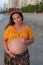 Beautiful pregnant latina woman on the beach