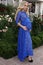 Beautiful pregnant woman with blond hair in elegant lace dress