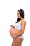 Beautiful pregnant woman holding near tummy pink sign Baby for newborn girl