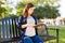 Beautiful pregnant woman reading a book about newborns