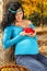 Beautiful pregnant woman with red arrow-wood