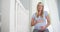 Beautiful pregnant woman sitting in baby room