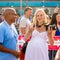 Beautiful pregnant woman soccer fan with camera in hands at the World Cup