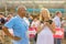 Beautiful pregnant woman soccer fan with camera in hands at the World Cup