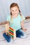 Beautiful preschool child with abacus