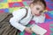 Beautiful preschooler girl studying book