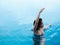 Beautiful professional asian woman practice aqua yoga water therapy side bend twist pose balance in swimming pool body mind spirit