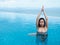 Beautiful professional asian woman practice aqua yoga water therapy tree pose balance in swimming pool body mind spirit spiritual