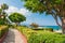 Beautiful promenade with green trees in Kemer, Turkey.