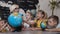 Beautiful pupils and teacher looks at globes in geography classroom on the lesson at the elementary school. Boys, girls