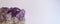 Beautiful and purple amethyst gemstone closeup on white background