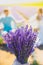 Beautiful purple lavender flowers on the summer field. Blurred Couple hugging hands, romantic love story. Warm and inspiration