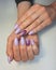 Beautiful purple manicure with shiny gradient design.