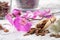 Beautiful purple orchid flower and wooden scoop of pine bark