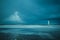 A beautiful rainbow appears over lighthouse