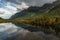 Beautiful Rainbow at Mountains of Milford Sound in New Zealand