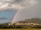 Beautiful rainbow over Assisi town Umbria, Italy
