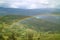 Beautiful rainbow over the lower mountaintop village view from Kuelap ancient citadel in Amazonas region, northern Peru