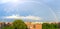 Beautiful rainbow spanning across the sky above urban rooftops in the Bronx, New York, NYC