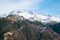 Beautiful range of high rocky mountains covered with snow during daytime