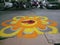 Beautiful rangoli design drawn by an artist on street of pune city