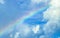 Beautiful and rare rainbow in cloudy sky blue background Mexico