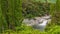 Beautiful Raukawa falls against a backdrop of lush greenery