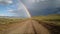 Beautiful real rainbow and dirt road