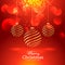 Beautiful red background with hanging golden christmas balls