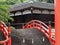 Beautiful red bridge in the garden of a Japanese Shinto shrine
