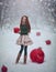 Beautiful red-haired girl like a doll with huge Christmas red balls walks in the winter fairy forest. Christmas card