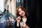 Beautiful red-haired girl. Medium length hair. Ginger drinking coffee from a straw