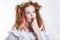 Beautiful red-haired girl with ribbons in her hair. Human emotions. Surprise