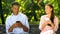 Beautiful red-haired lady ignoring man, sitting on bench in park, failed date