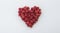 A beautiful red heart made of raspberries