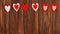 beautiful red heart ornaments on a wooden background on lovers
