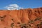 Beautiful red Konorchek ravine with small white cloud against blue sky,Issyk-Kul region,Central Asia, famous hiking place