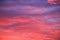 Beautiful red, pink feather clouds against the sky in sunrise in the morning. Picturesque magic background.