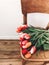 Beautiful red and pink tulips on stylish wooden rustic chair in home. Hello spring concept. Countryside living. Modern rural still