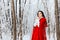 Beautiful Red Riding Hood Princess in Magic Winter Forest