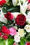 Beautiful red rose, carnation and lilly with water drops.